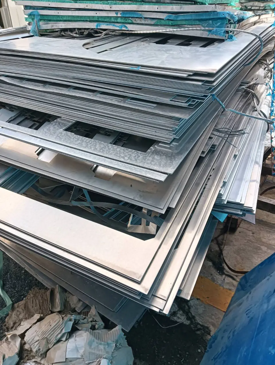 Stacked galvanized steel sheet offcuts
