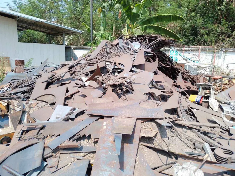 Steel plate offcuts piled in a yard